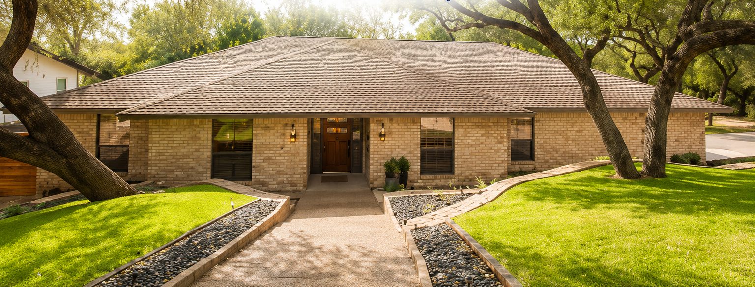 Front of the home with live oaks