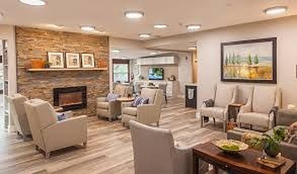 Living room with fireplace and seating groups